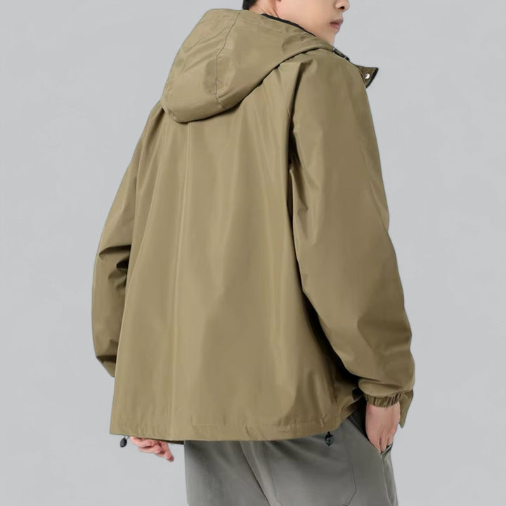 Lightweight men's windbreaker jacket, relaxed fit, providing weather protection for casual outdoor adventures.