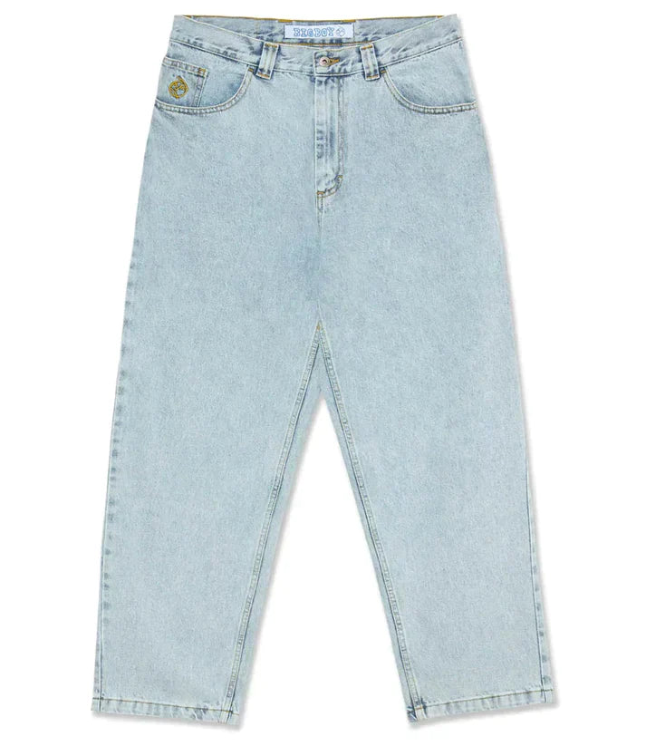 Model wearing men's relaxed wide-leg denim pants, styled for a contemporary spring casual outfit.