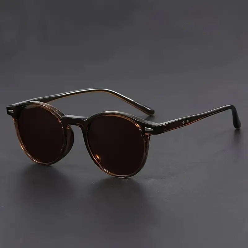 Tortoiseshell round sunglasses for men, offering a lightweight retro style. Comfortable vintage fashion eyewear.