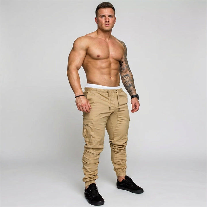 Men's rugged multi-pocket cargo joggers in full view, ideal for urban adventures & casual street style.