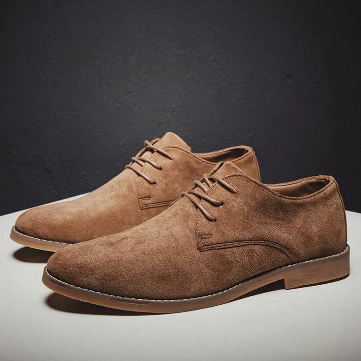 Men's Sebastian suede oxford dress shoes, perfect for formal and business attire. Elegant lace-up footwear.