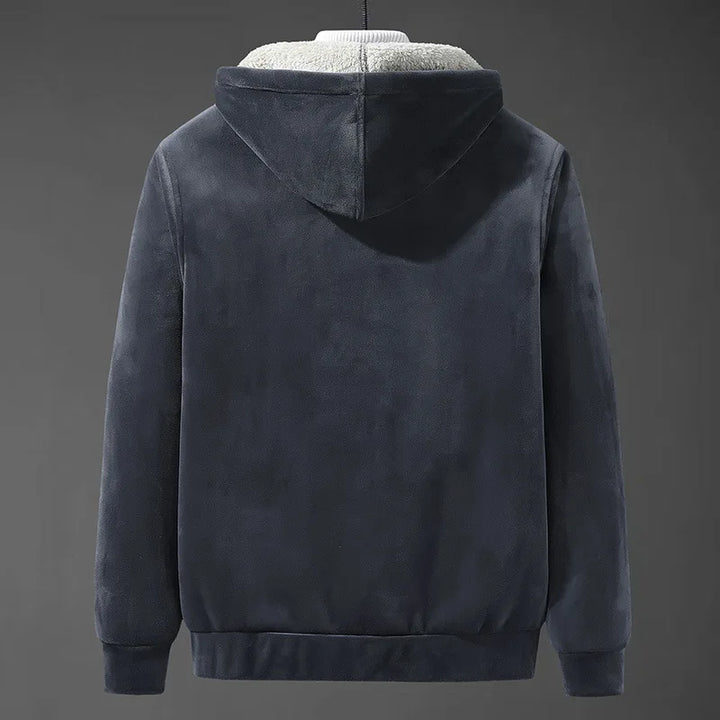 Detail of the durable fabric and cozy sherpa interior of a men's winter coat