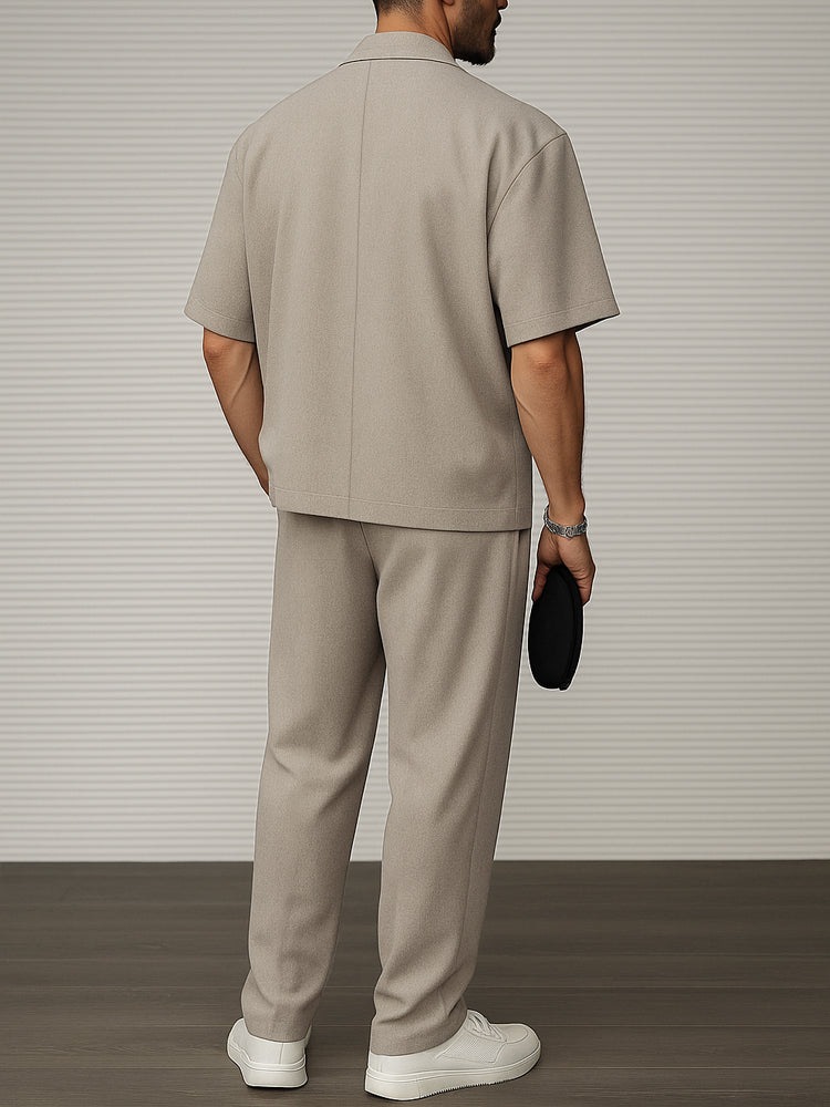 Detail of men's short sleeve blazer & tailored trousers fabric. Premium menswear two-piece for formal & smart casual events.