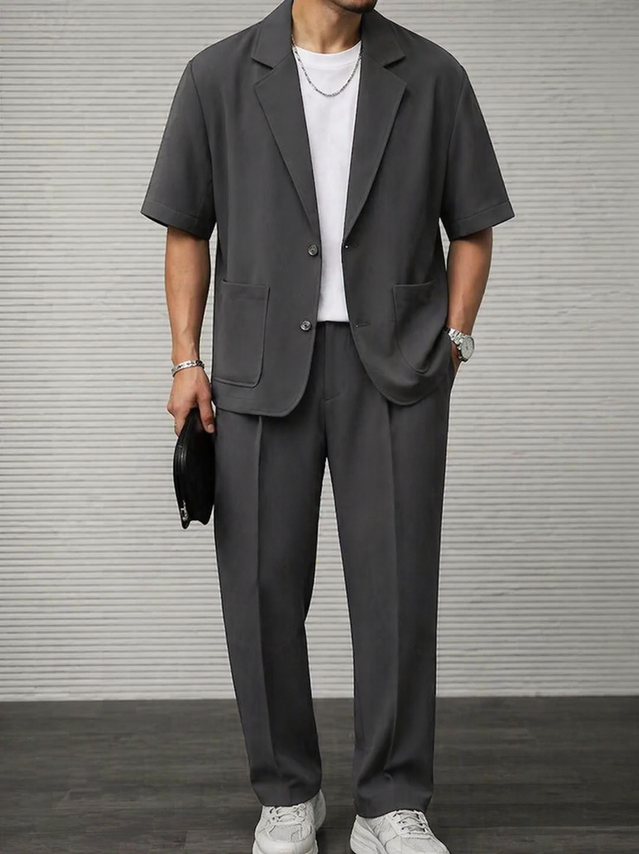 Professional men's short sleeve blazer & tailored trousers. Business casual two-piece suit ideal for formal office wear.