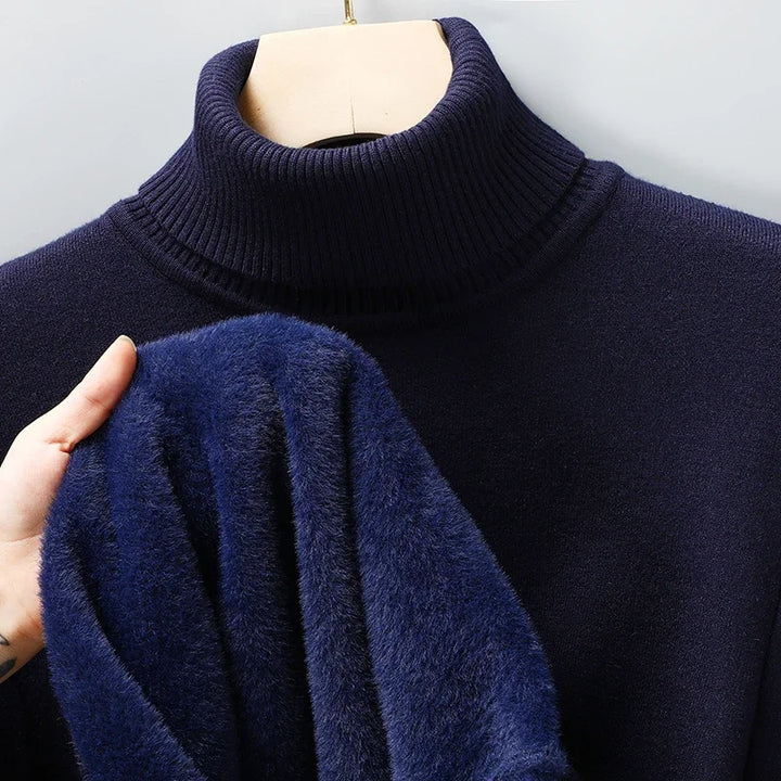 Man wearing a sleek sculpted knit turtleneck sweater, showcasing men's winter fashion & sophisticated, classic style.