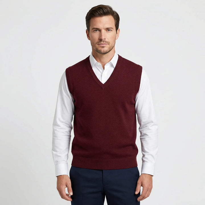 Modern men's V-neck sweater vest. Versatile layering piece for casual or semi-formal fashion.
