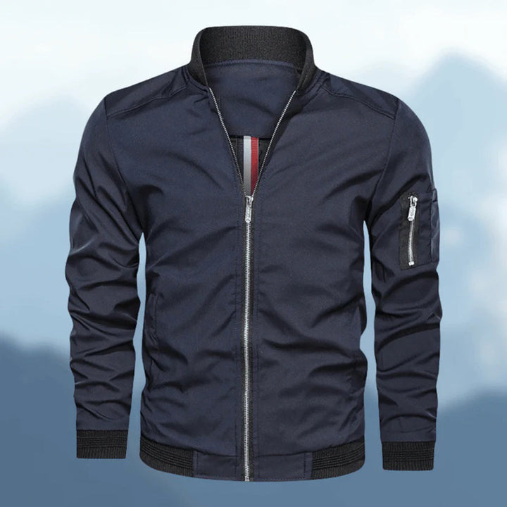 Trendy men's slim fit bomber jacket in navy blue, side view, lightweight casual outerwear.