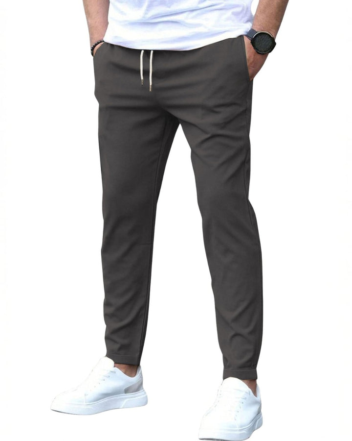 Men's drawstring chino pants, slim fit design for modern comfort and casual style.