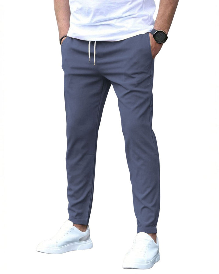 Flexible men's trousers: slim fit chino pants with drawstring, great for active lifestyles.