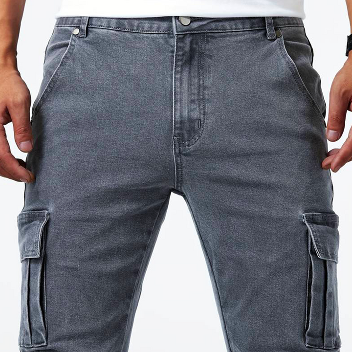 Man wearing modern slim fit blue cargo pants, showcasing casual everyday comfort & style.
