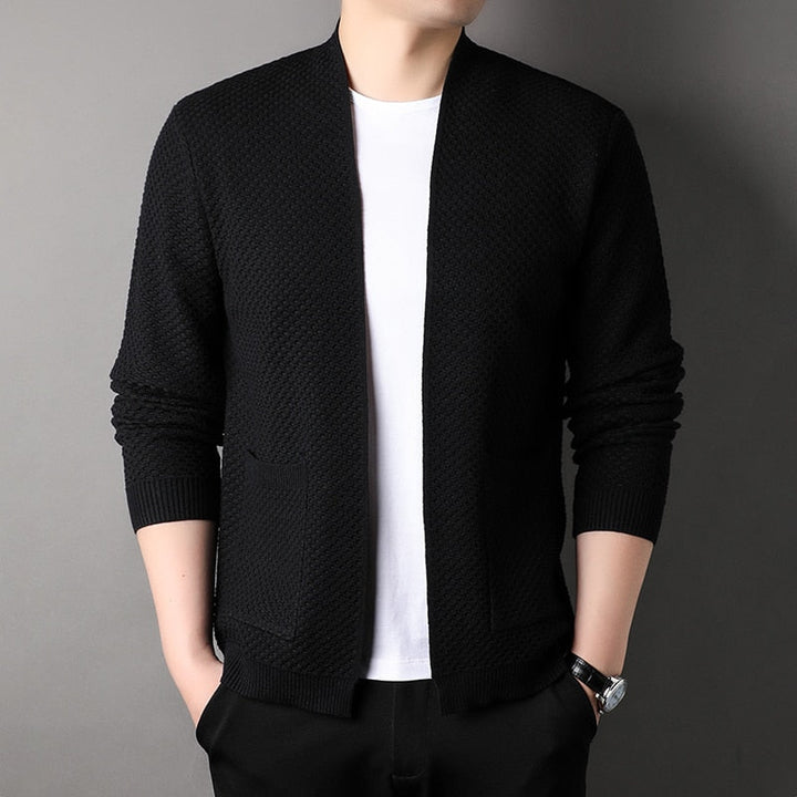 Close-up of a men's knitted slim fit cardigan, highlighting the texture and pocket detail.