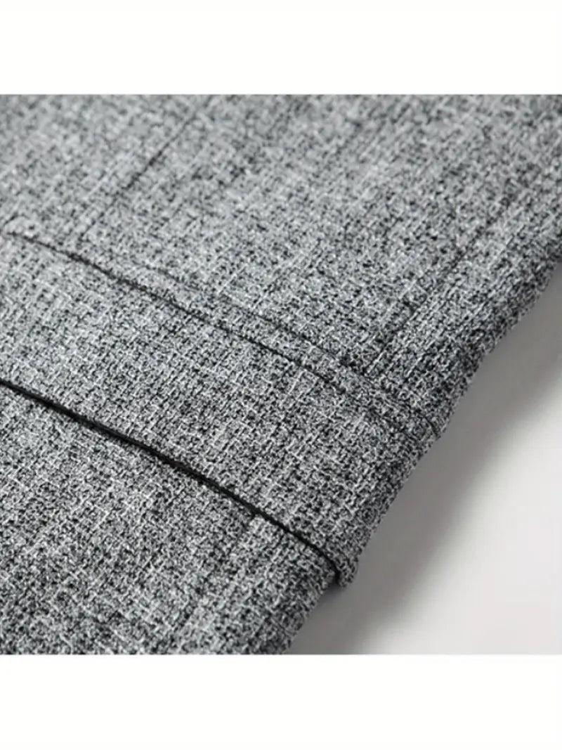 Close-up of a men's slim fit spring blazer fabric, highlighting its lightweight and no-iron features.