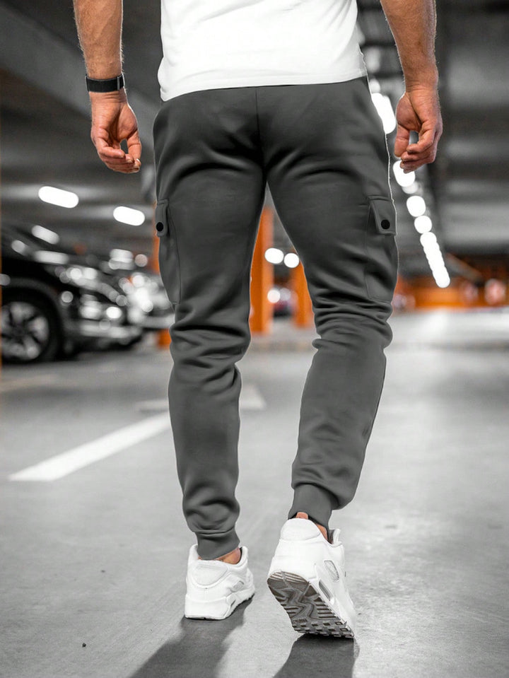 Tapered men's slim-fit joggers with a modern streetwear design, ensuring a sleek look.