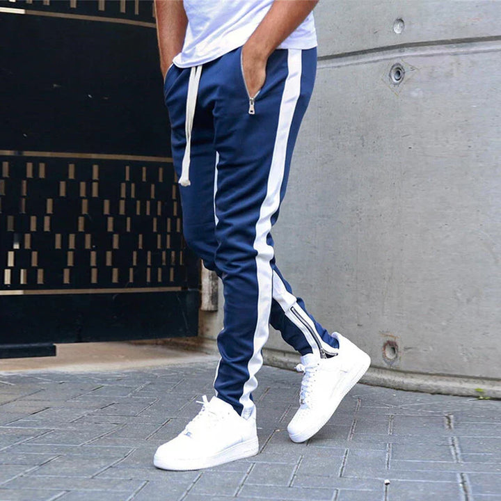 Sporty men's slim fit casual sweatpants with convenient zip hems for modern street style.