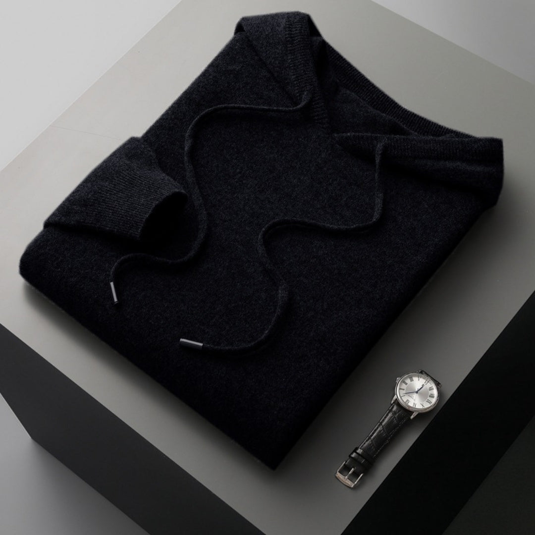 Folded soft knit hooded pullover for men, showcasing its compact and comfortable design for spring