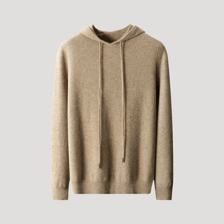 Detail of the ribbed cuffs and hem on a men's knit hooded pullover, adding to its casual spring style
