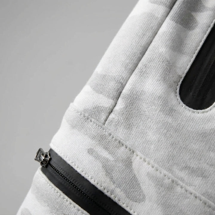 Comfortable men's athletic pants; tapered joggers for workouts or casual wear, complete with secure zipper pockets.