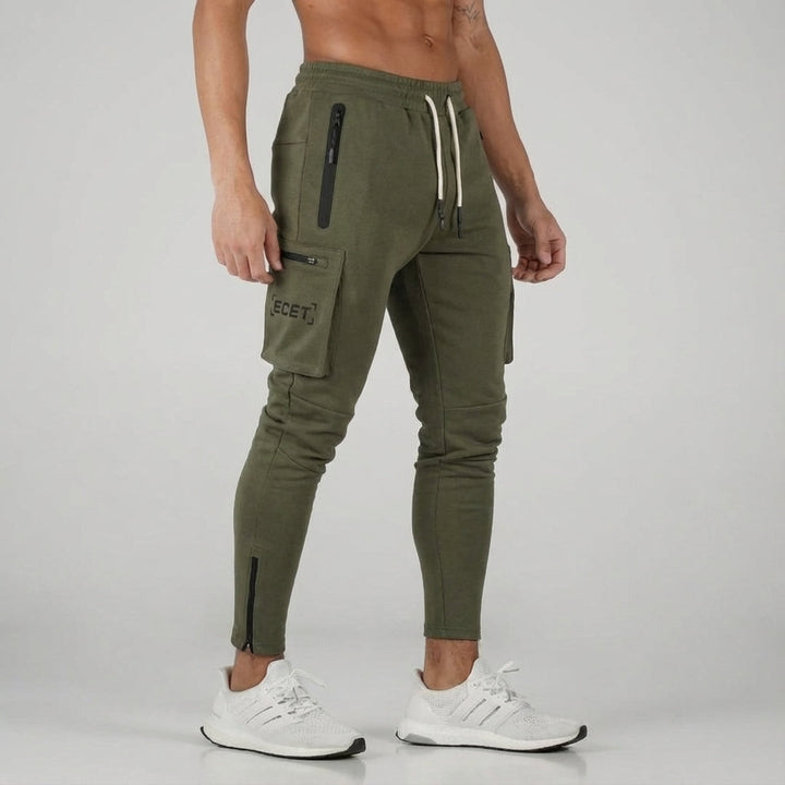 Stylish men's tapered fit gym wear joggers with secure zipper pockets, perfect for training & casual comfort.