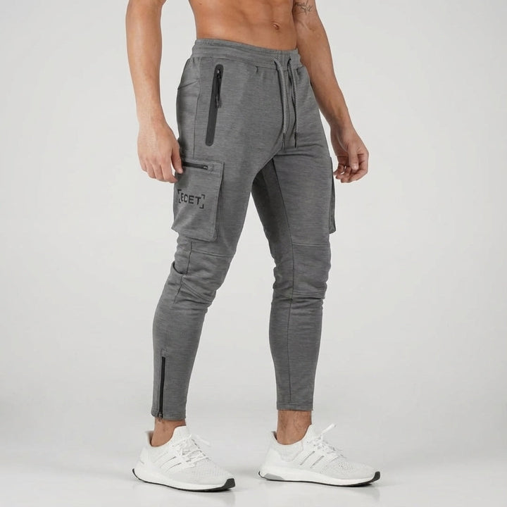 Men's workout gear joggers, featuring a tapered fit & secure zipper pockets, ideal for gym, running, and casual wear.