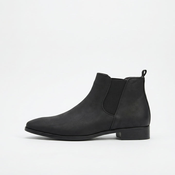 Stylish black men's Stratton Chelsea boots, perfect for casual or sophisticated dress outfits.