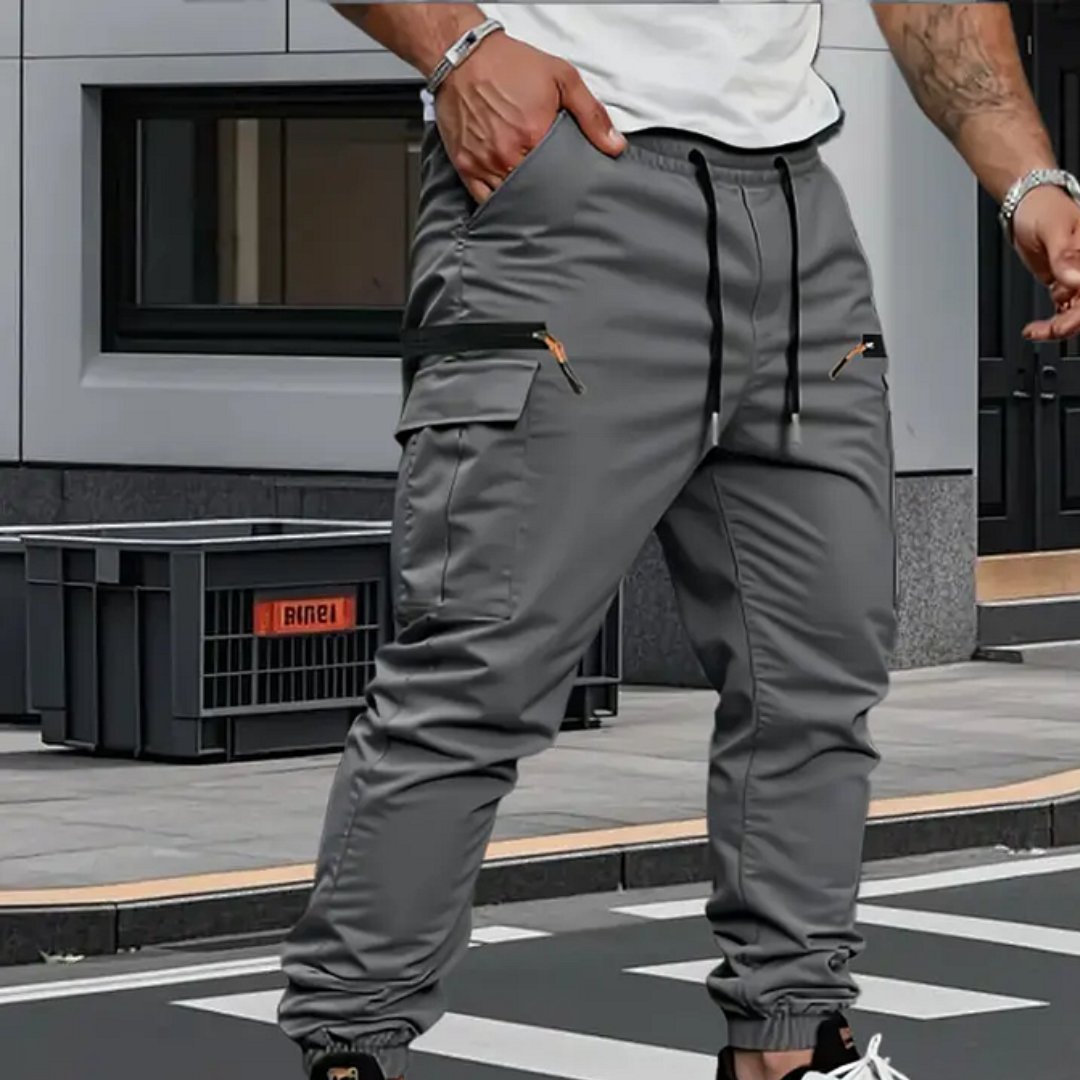 Comfortable men's stretch cargo joggers, versatile for casual wear or active lifestyles. Tapered fit, multi-pocket details.