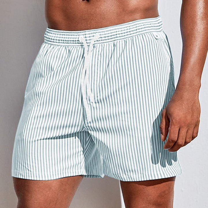 Quick-dry striped men's swimwear with adjustable waist for comfortable summer fashion.