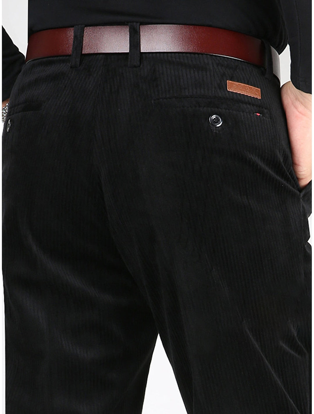 Men's structured ribbed pants in a dark color, perfect for an elevated casual look and everyday wear.
