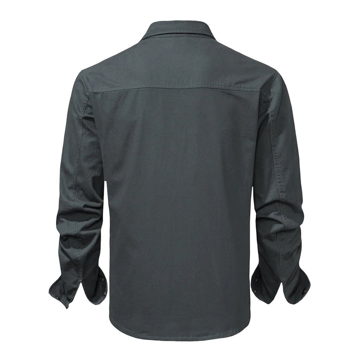 Modern men's fashion shirt, button-down style, showcasing sharp contrasting collar and cuffs.