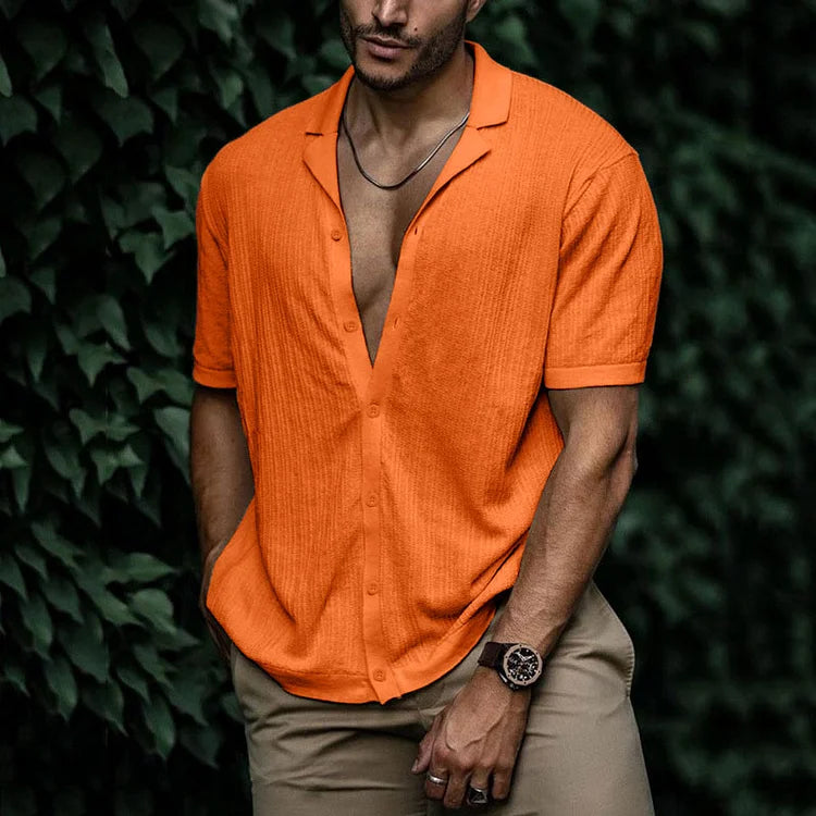 Detail shot of the distinctive Cuban collar on a stylish men's textured summer shirt for warm weather.