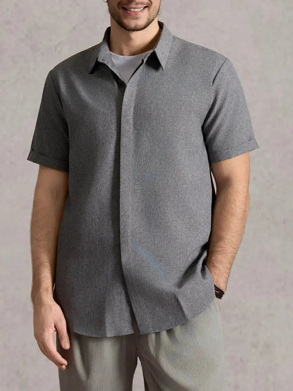 Versatile men's textured short sleeve shirt, button down, ideal for various summer outfits.