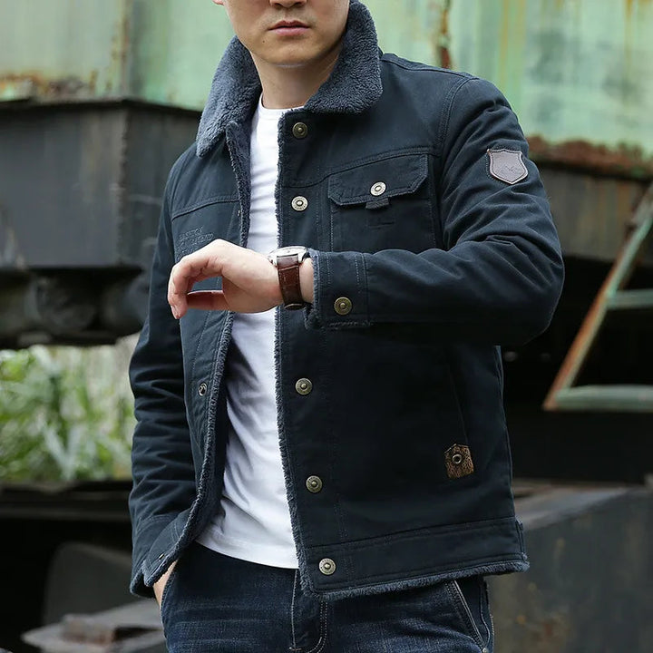 Men's stylish winter jacket with a rugged design and cozy faux fur collar. Perfect for fall and winter outerwear.