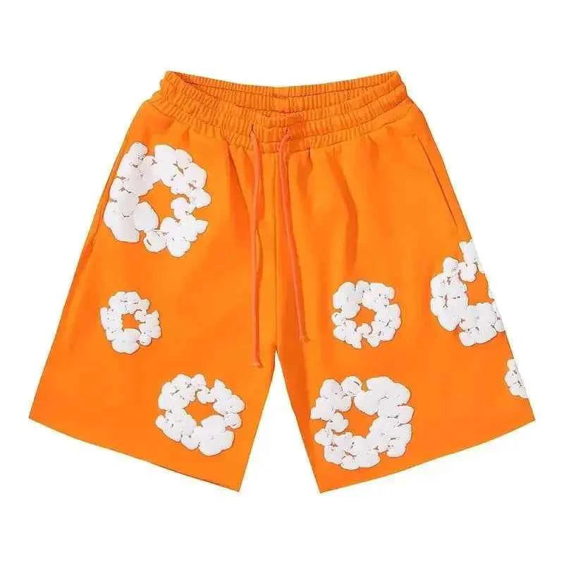 Men's summer shorts with bold floral print, perfect for streetwear style.