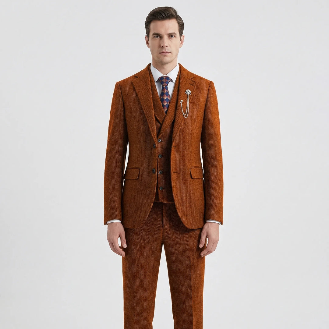 Model in a classic men's tailored fit 3-piece herringbone suit. Ideal gentlemen's fashion for formal occasions.