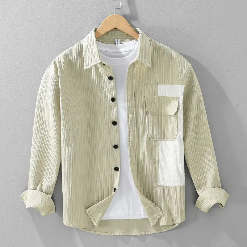 Close-up of corded fabric on a men's button-up shirt, cream beige with textured finish