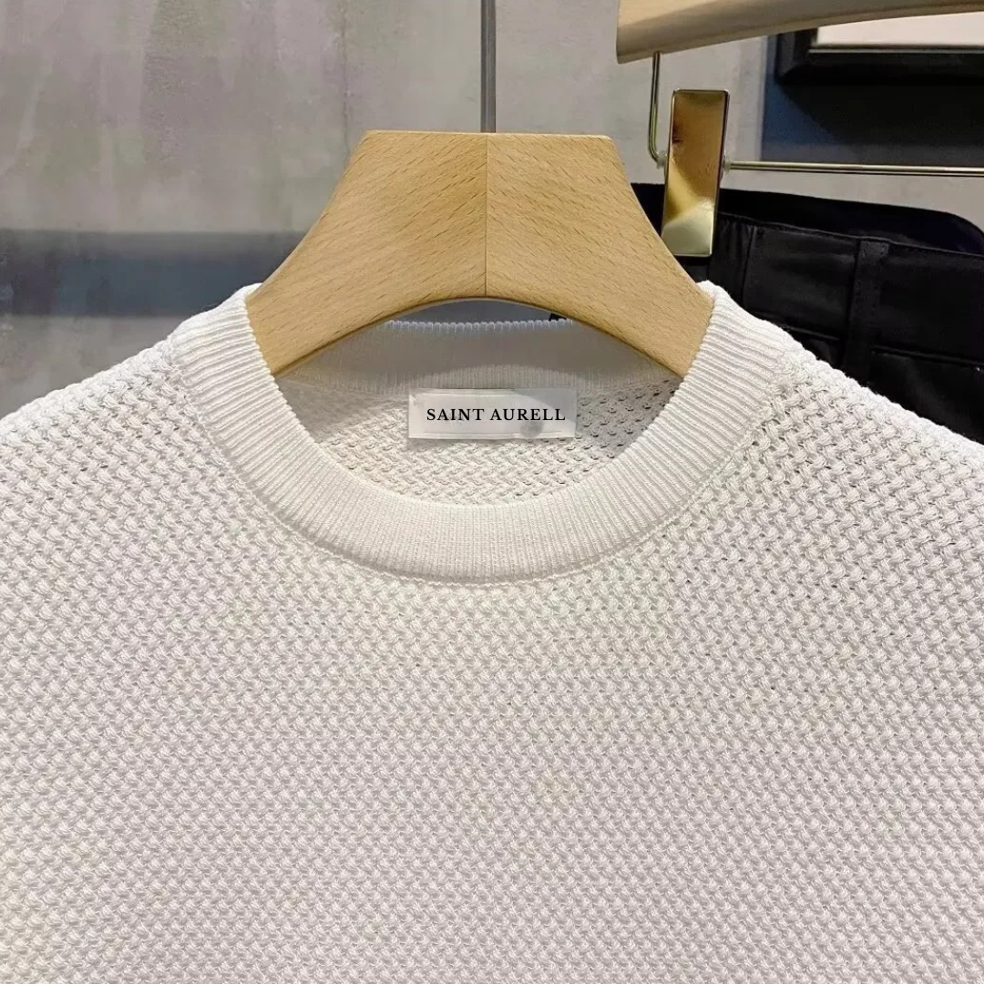 Comfortable men's long sleeve sweater featuring a unique textured knit pattern and classic crewneck design.
