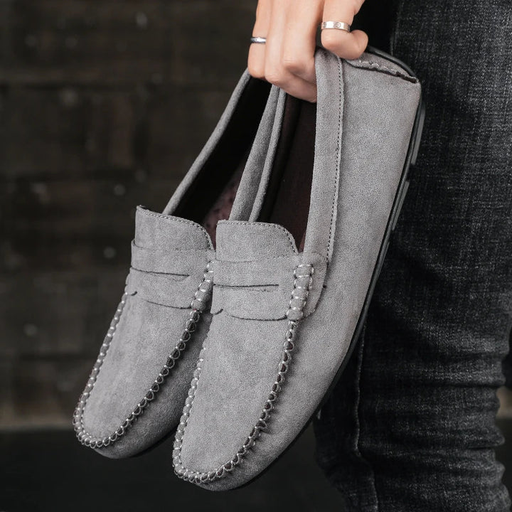 Black men's Tivoli leather penny loafers, classic slip-on dress shoes, ideal for formal or smart casual outfits.