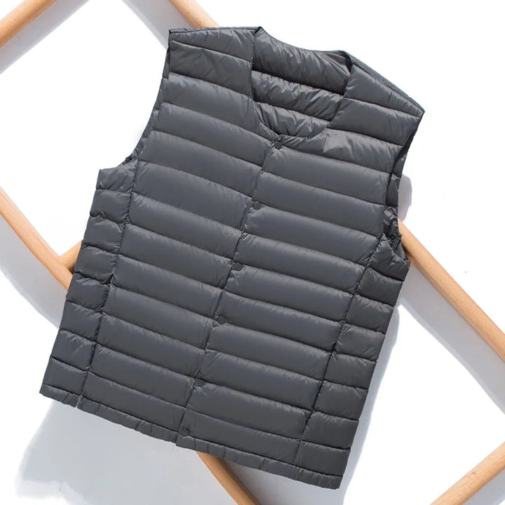 Durable men's ultralight gilet, offering insulation and comfort for multi-season wear. Casual padded outerwear.