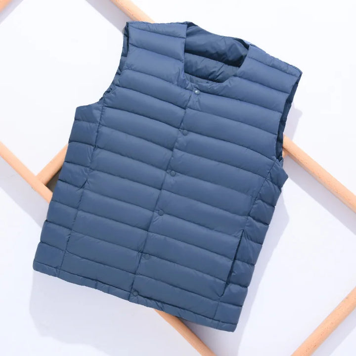Men's travel essential ultralight vest, easy to pack and wear for diverse climates and activities. Sleeveless.