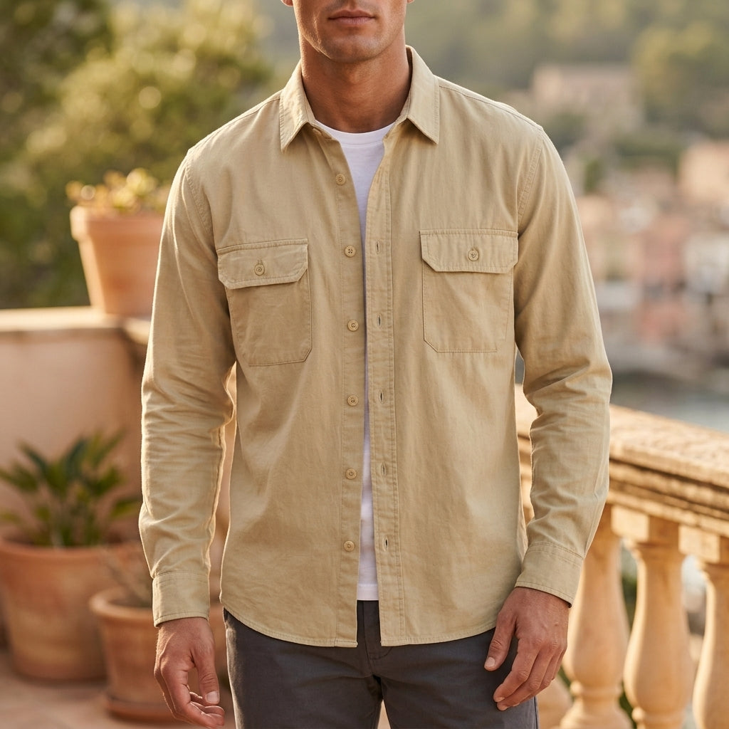 Sophisticated men's cream button-up overshirt, ideal for versatile layering. Features long sleeves & practical chest pockets.