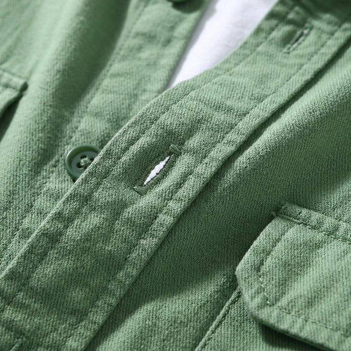 Men's tailored fit overshirt in a vibrant green, with button-up front & long sleeves. A sophisticated casual layering shirt.