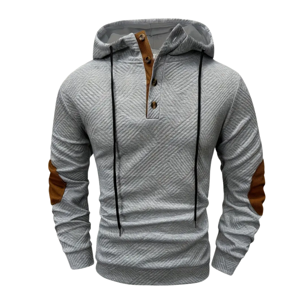 Man wearing versatile outdoor hoodie, showcasing comfort fit, stretch, & button placket for sporty style.