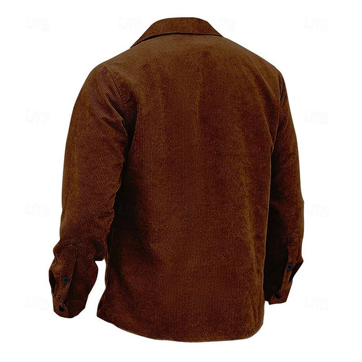 Stylish man in tailored men's vintage Henri jacket, suitable for both casual & formal outerwear.