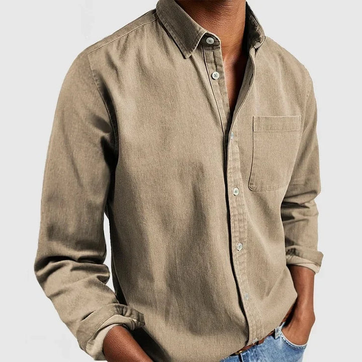 Chambray long sleeve men's shirt with classic button-down style. Ideal for casual or layered outfits.