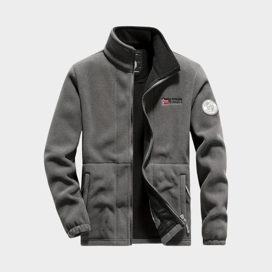 Close-up of the soft fabric and durable full zip on a men's warm fleece jacket, suitable for active menswear.