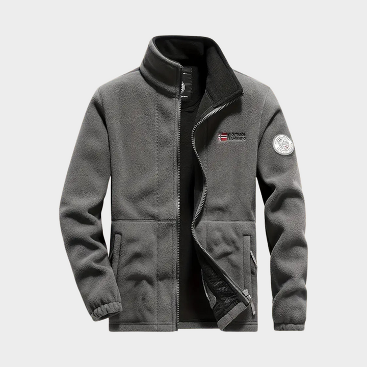 Close-up of the soft fabric and durable full zip on a men's warm fleece jacket, suitable for active menswear.