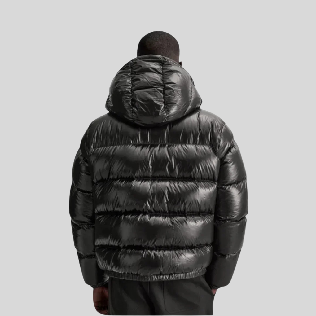 Warm men's quilted winter jacket. Durable, stylish outerwear for cold weather. Features full zip & stand collar.