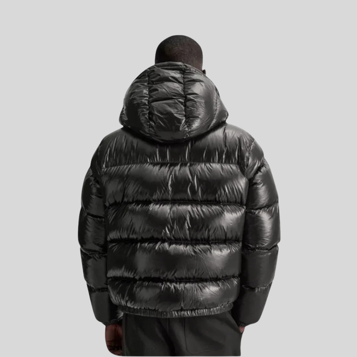 Warm men's quilted winter jacket. Durable, stylish outerwear for cold weather. Features full zip & stand collar.