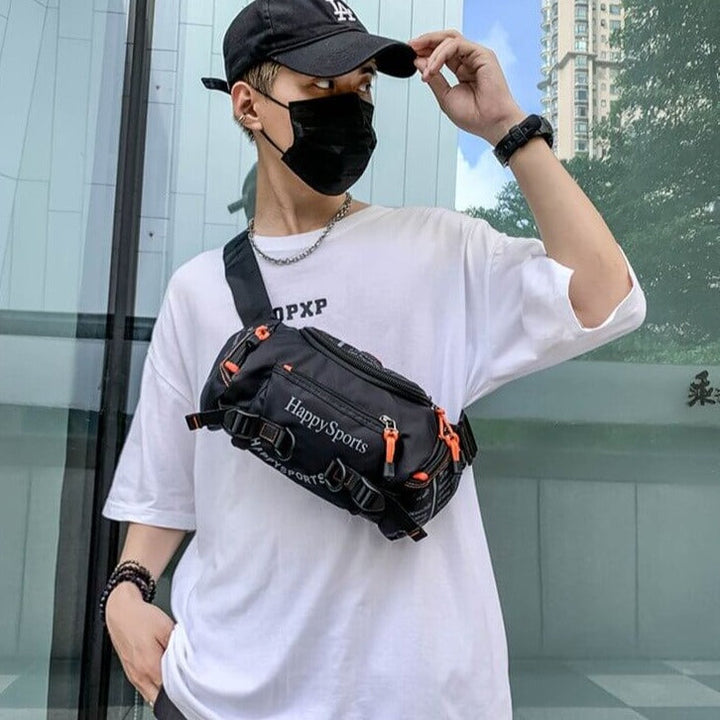 Practical men's water-resistant travel bag, convertible waist to crossbody style.