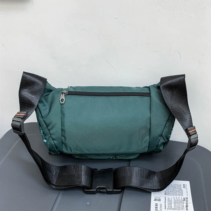 Compact men's water-resistant sling, ideal for adventure travel & urban exploration.