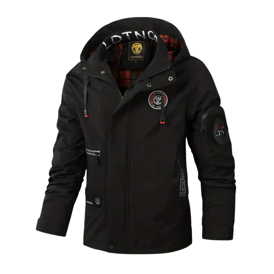 Man hiking in a robust men's waterproof & windproof outdoor jacket with hood, perfect for trails.